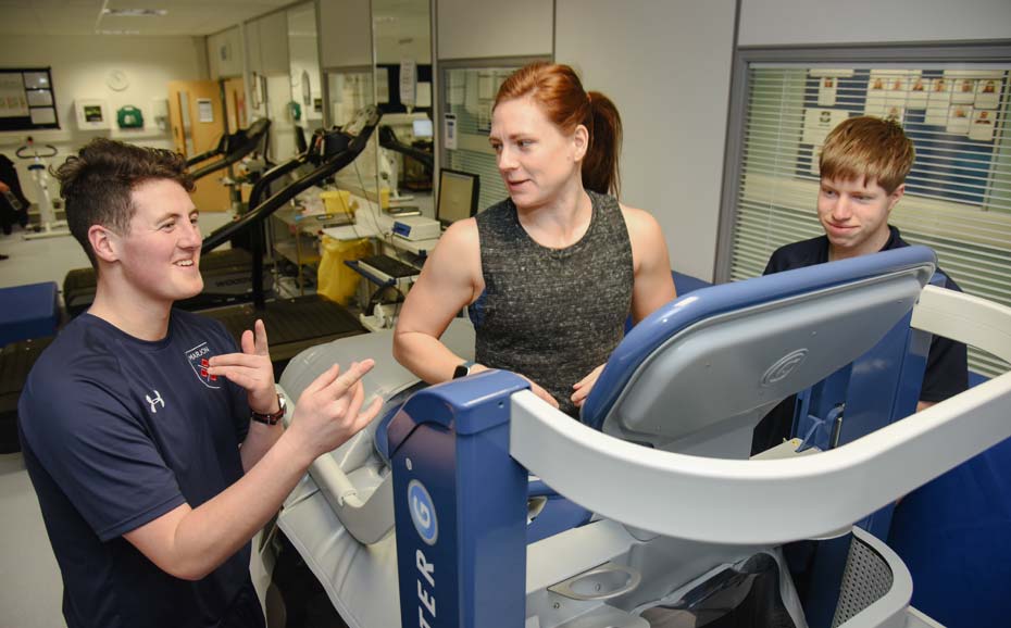 Three students in a practical session on the anti-gravity treadmill