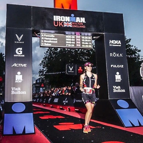 Marjon Student Connie Baker crossing the finish line at the UK Ironman competition in Bolton