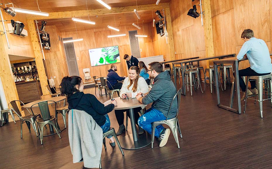 The Barjon open social area, with a group of four students sat at a table