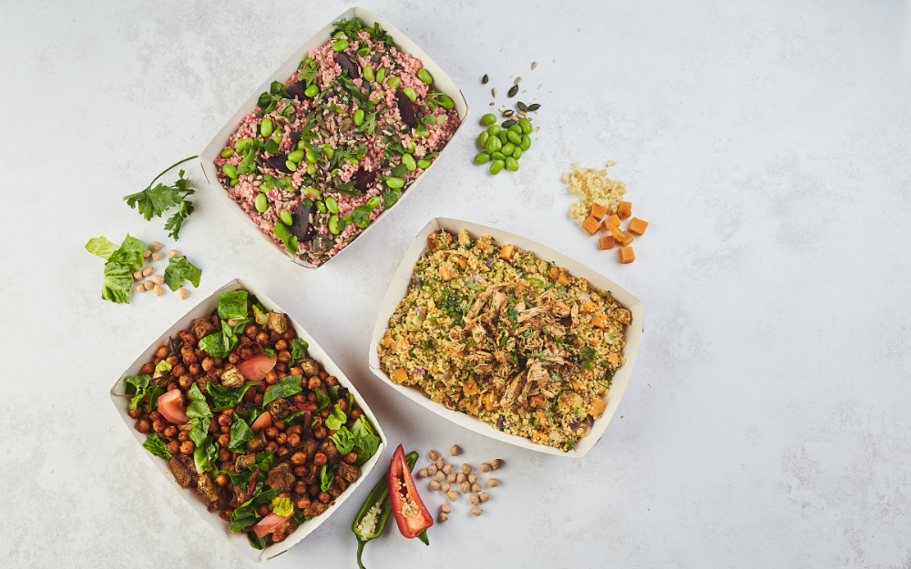 Some dirty salads are sat in a white liminal space. One has chickpeas, one has rice and one has couscous.