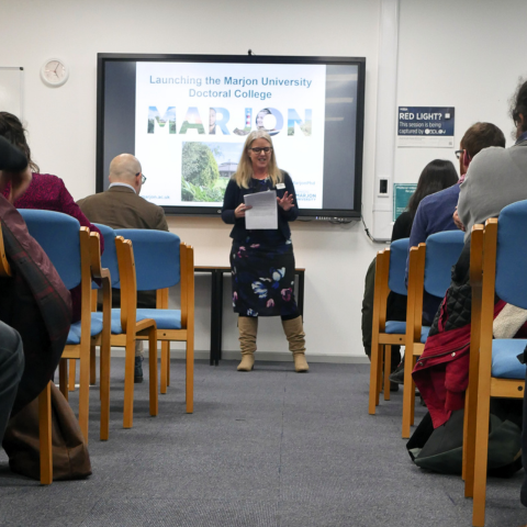 Professor Debby Cotton presenting to an audience