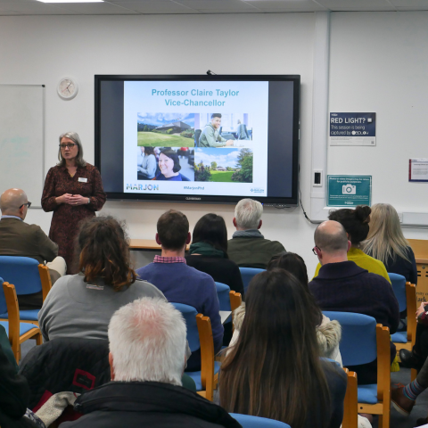 Professor Claire Taylor presenting to a research community